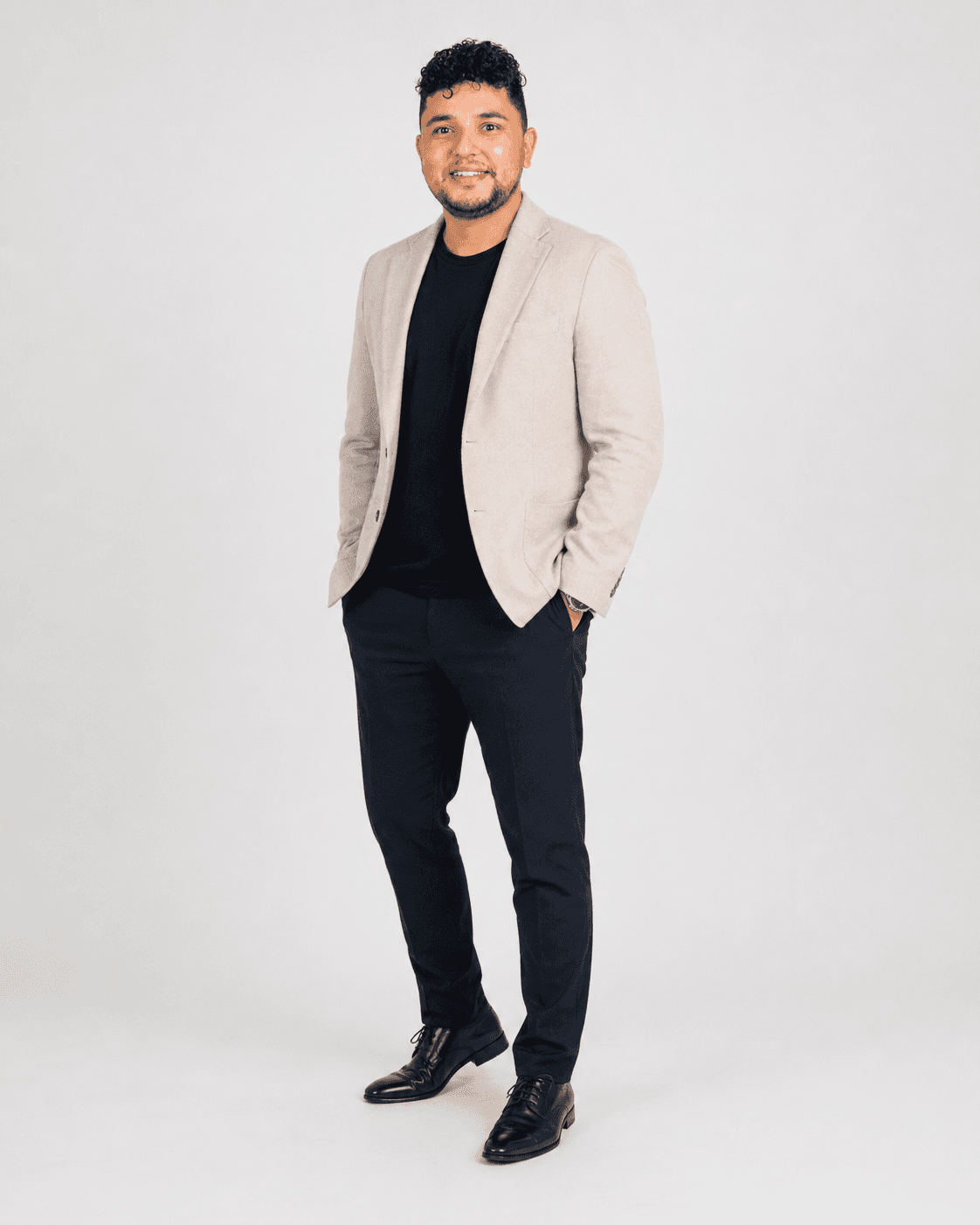 Rabin Paudel standing in a cream blazer
